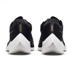 Nike Men's ZoomX Vaporfly Next % 2 Racing Shoe - Black/White/Metallic Gold Coin - Regular (D) 13 Nike Men's ZoomX Vaporfly Next % 2 Racing Shoe - Black/White/Metallic Gold Coin - Regular (D)